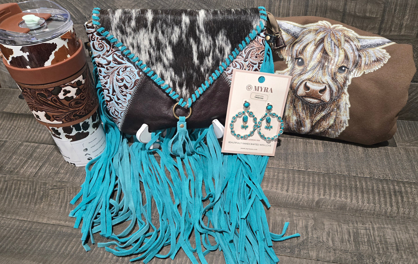 Turquoise fringe bag with cow print tumbler and cow design